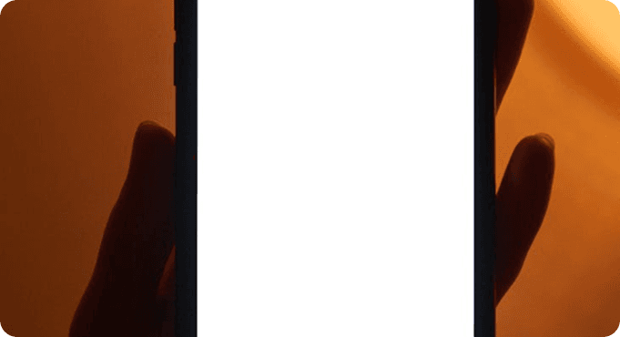 Hands holding a smartphone with a blank screen